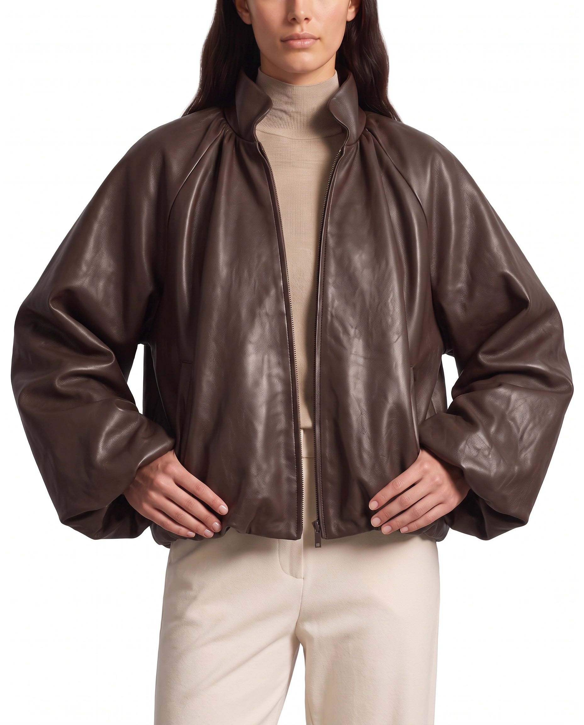 Hero pose of The Eira women's brown real lambskin oversized balloon-sleeve leather jacket by Amrika Leather styled in a contemporary fashion look.