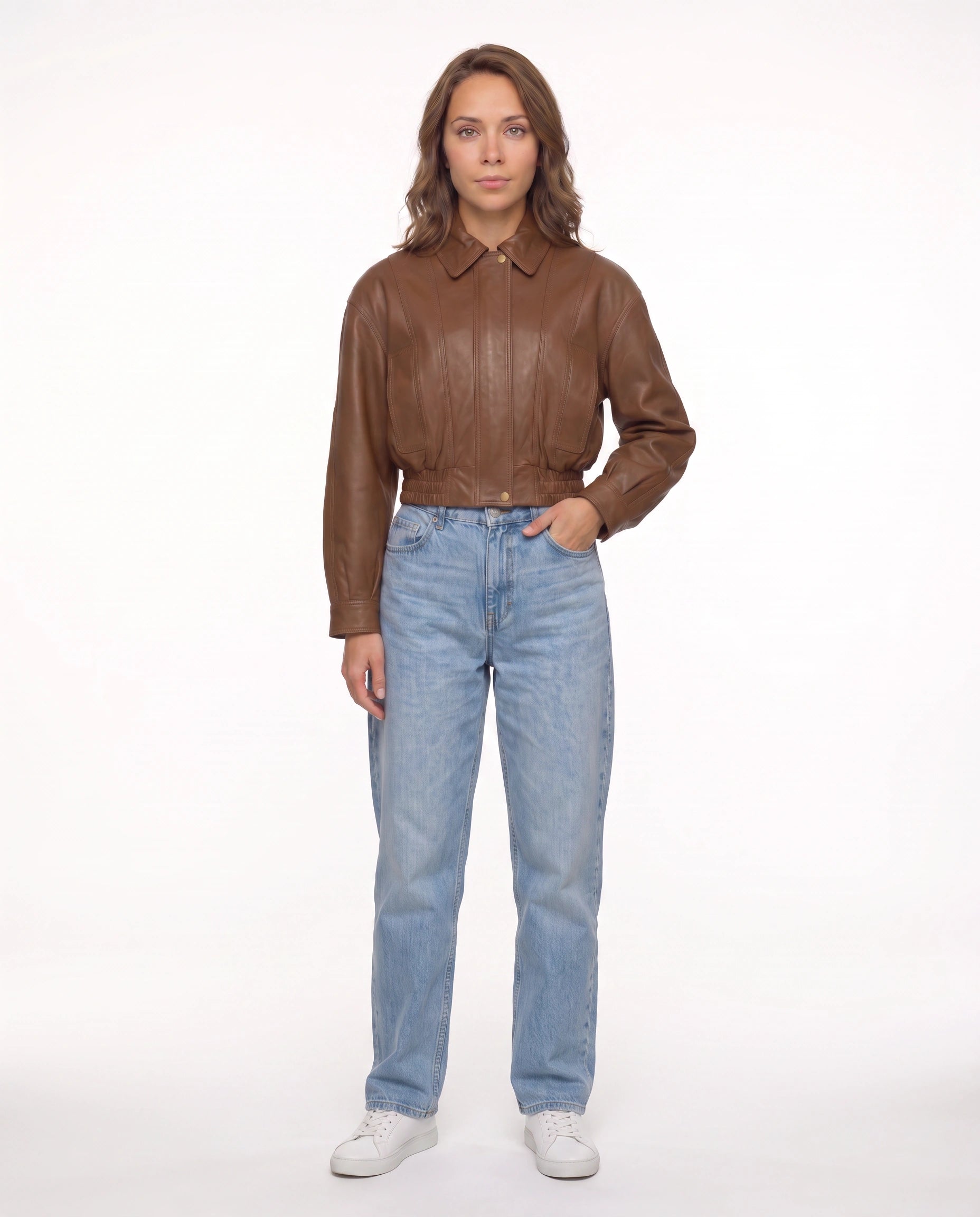 Full-length view of The Elowen women's brown genuine lambskin cropped leather jacket showcasing its complete silhouette and modern styling.