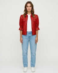Model wearing The Lumi women's red real lambskin leather puff sleeve jacket by Amrika Leather.