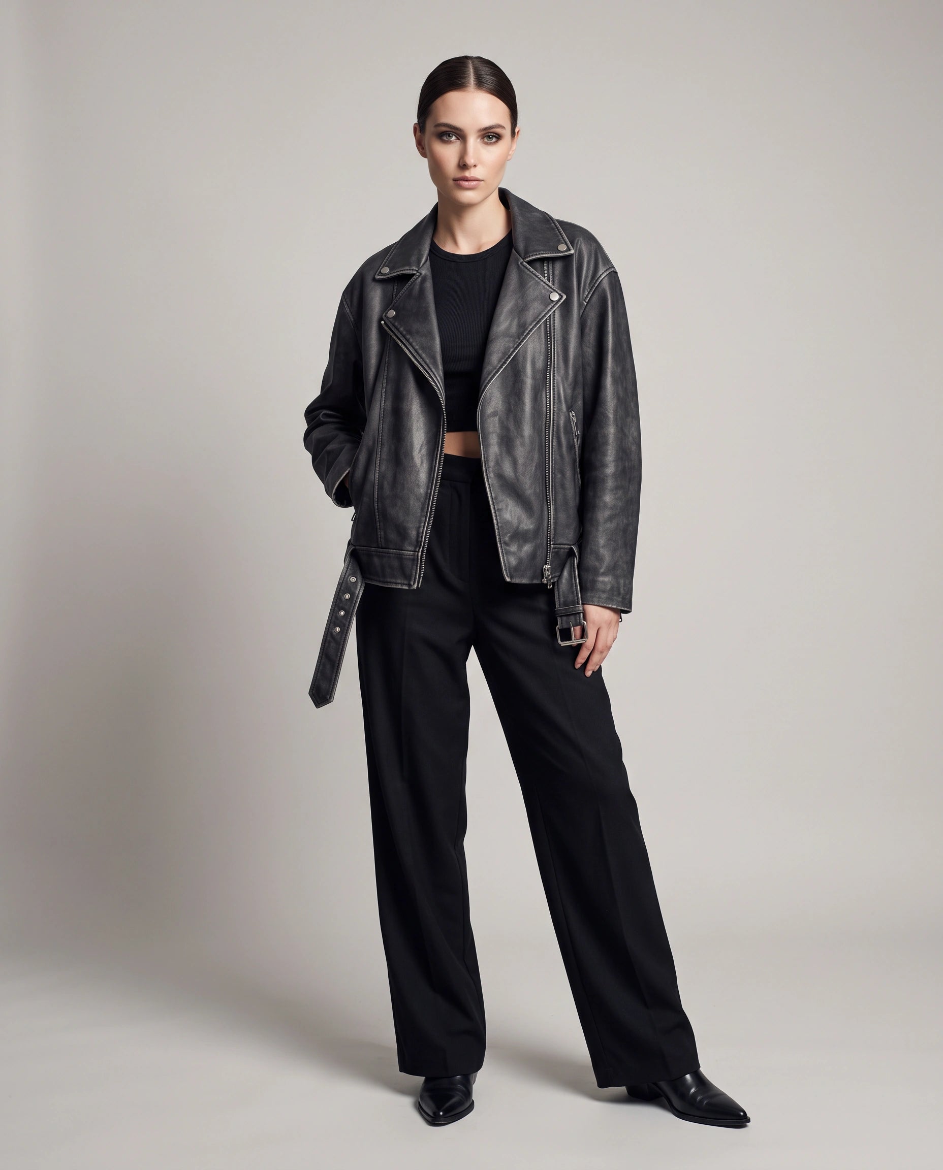 Full-length view of The Zora women's oversized worn-off lambskin motorcycle leather jacket showcasing its complete oversized silhouette and adjustable belt details.