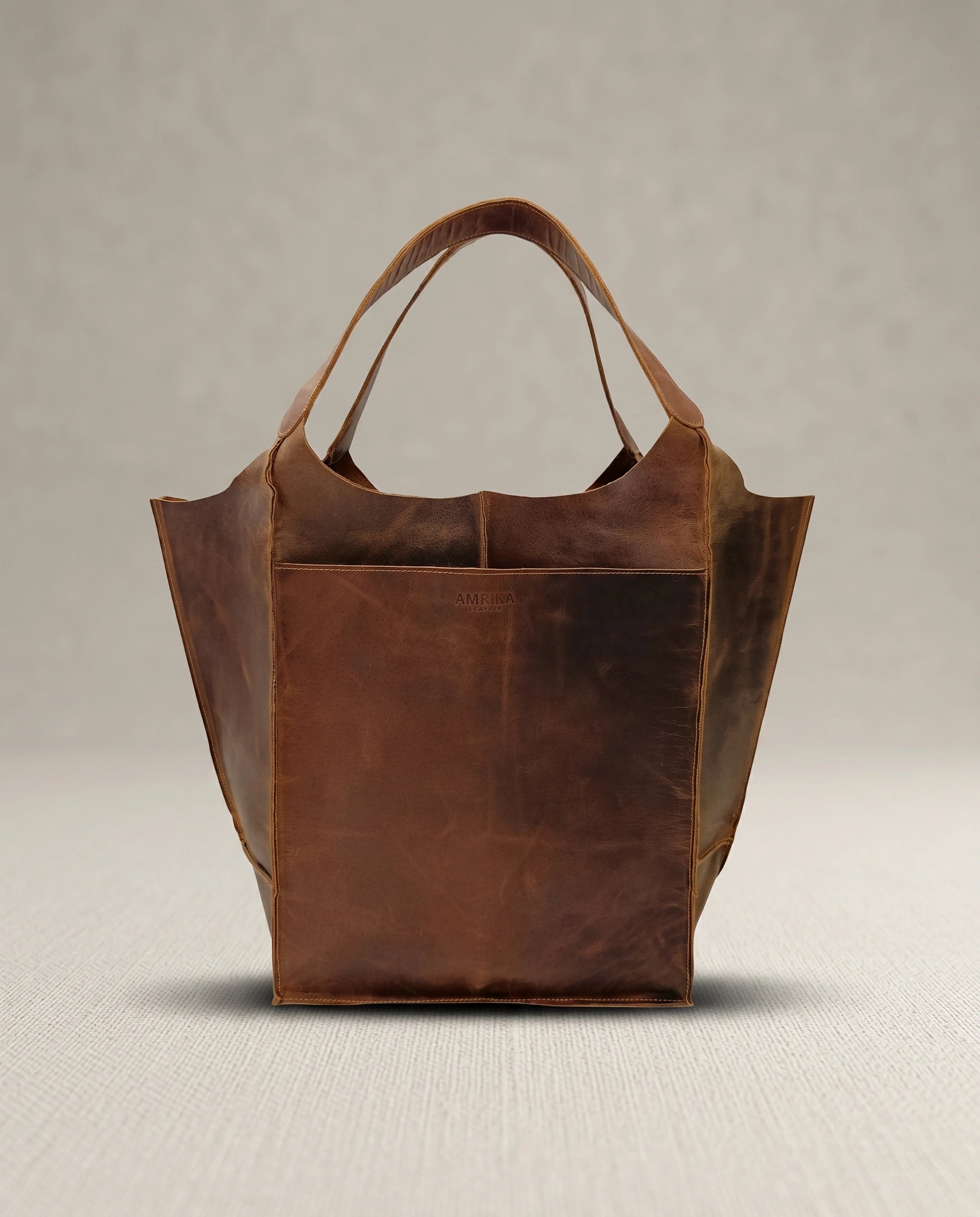 The Grand large buffalo leather tote bag by Amrika Leather in vintage brown pull-up leather.
