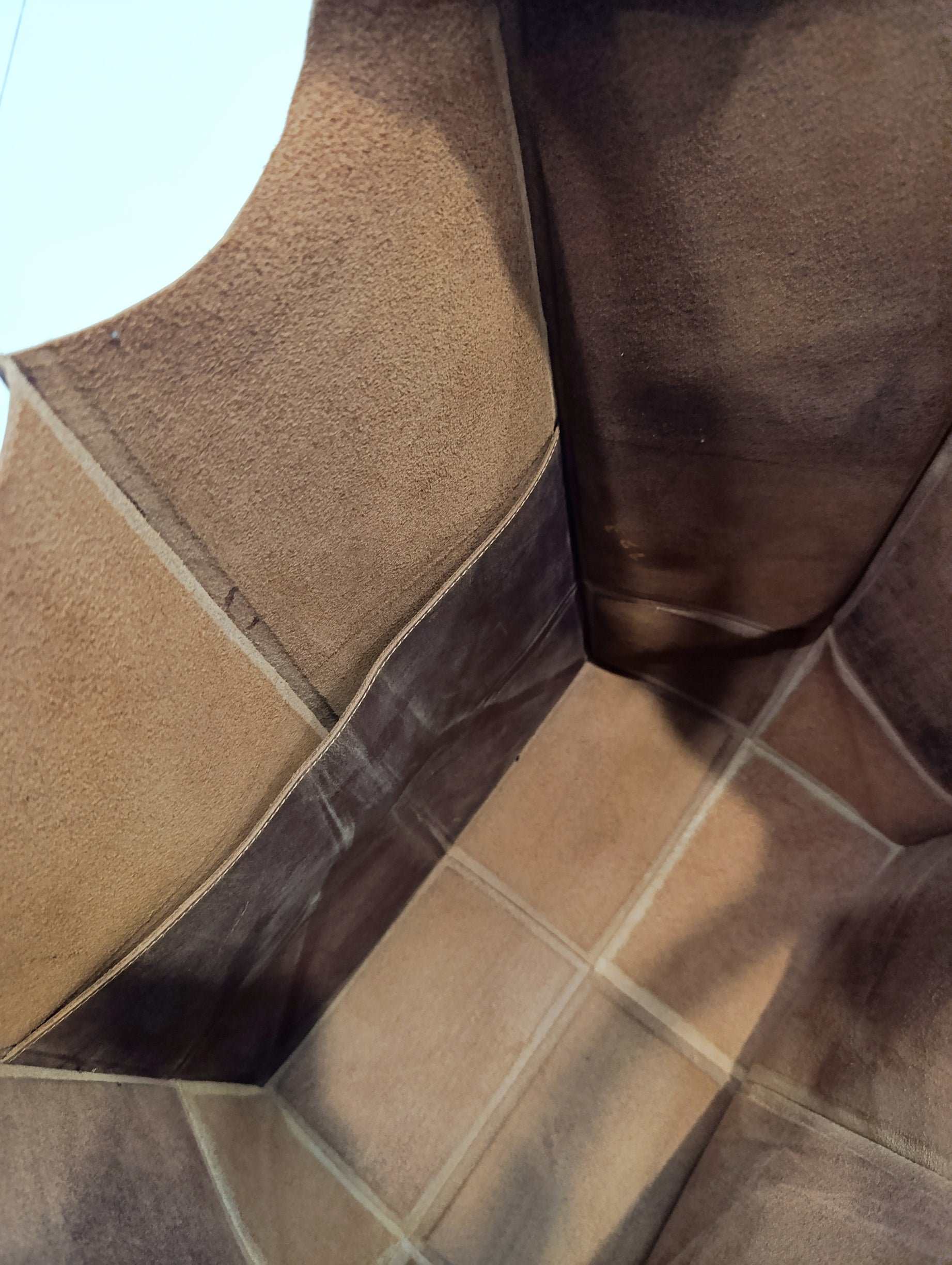Spacious unlined interior of The Grand large buffalo leather tote bag with a large inside pocket.