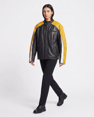 Full-length view of The Monaco oversized racing leather jacket styled with a contemporary outfit.