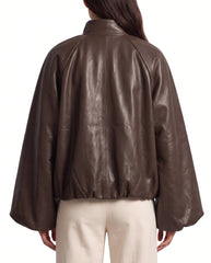 Back view of The Eira women's brown genuine lambskin oversized balloon-sleeve leather jacket by Amrika Leather highlighting its relaxed oversized silhouette.