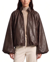 Front view of The Eira women's brown real lambskin oversized balloon-sleeve leather jacket by Amrika Leather featuring a high collar and voluminous sleeves.
