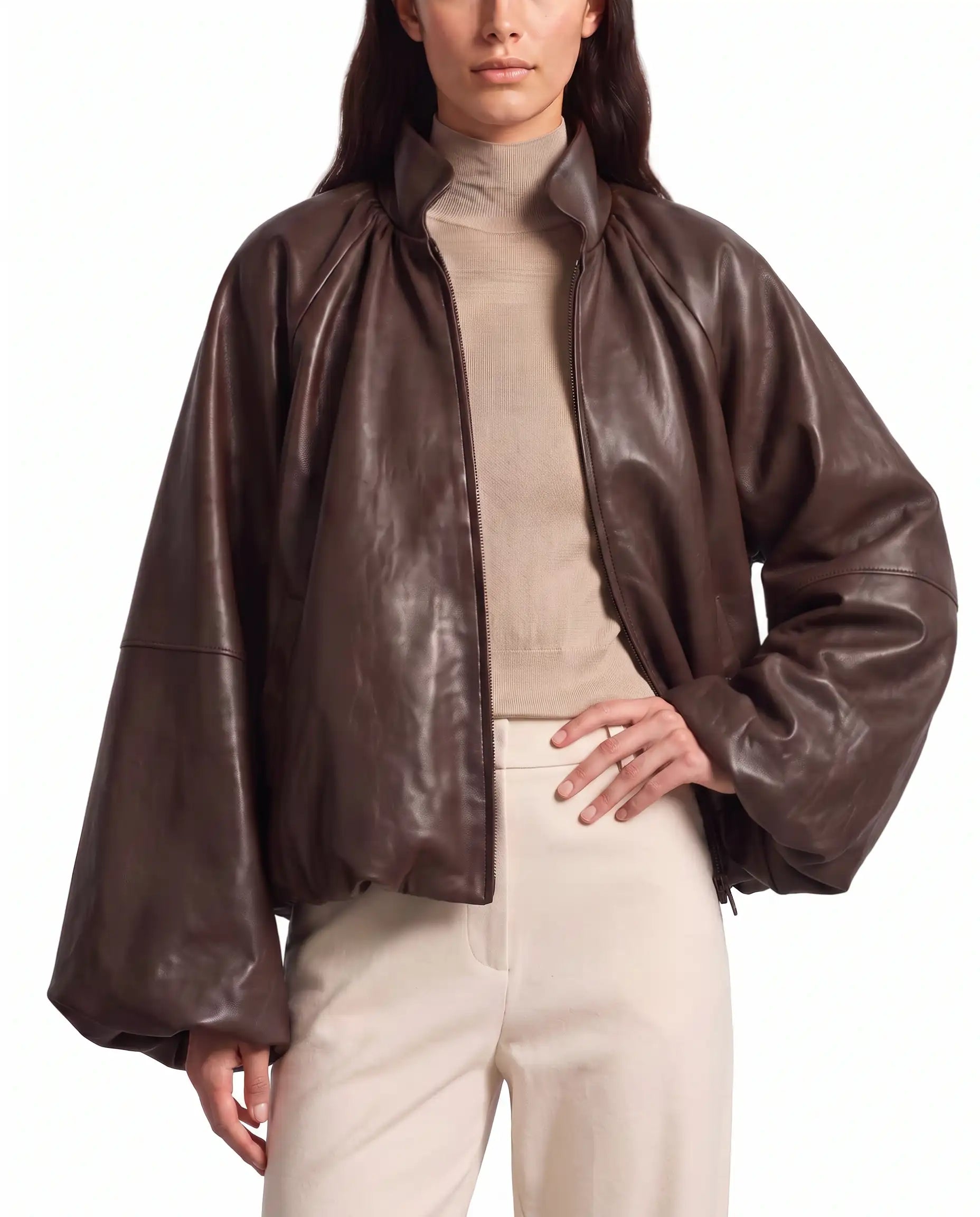 Hero pose of The Eira women's brown real lambskin oversized balloon-sleeve leather jacket by Amrika Leather styled in a contemporary fashion look.