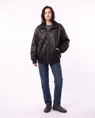 Full-length view of The Juno women's washed lambskin leather bomber jacket showcasing its complete relaxed silhouette and ribbed detailing.