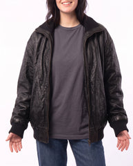Hero view of The Juno women's washed lambskin leather bomber jacket styled in a relaxed contemporary fashion look.