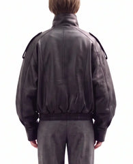 Back view of The Noa women's black genuine lambskin oversized funnel neck leather jacket by Amrika Leather highlighting the clean oversized silhouette.