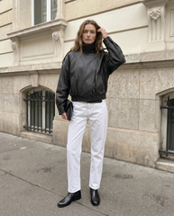 Full-length view of The Noa women's black genuine lambskin oversized funnel neck leather jacket by Amrika Leather showcasing the complete oversized silhouette and styling.