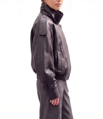 Side view of The Noa women's black genuine lambskin oversized funnel neck leather jacket by Amrika Leather showcasing the relaxed silhouette and modern profile.