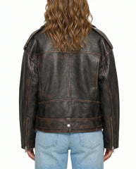 Back view of The Rowan women's distressed brown genuine lambskin oversized biker leather jacket by Amrika Leather highlighting the relaxed oversized fit.