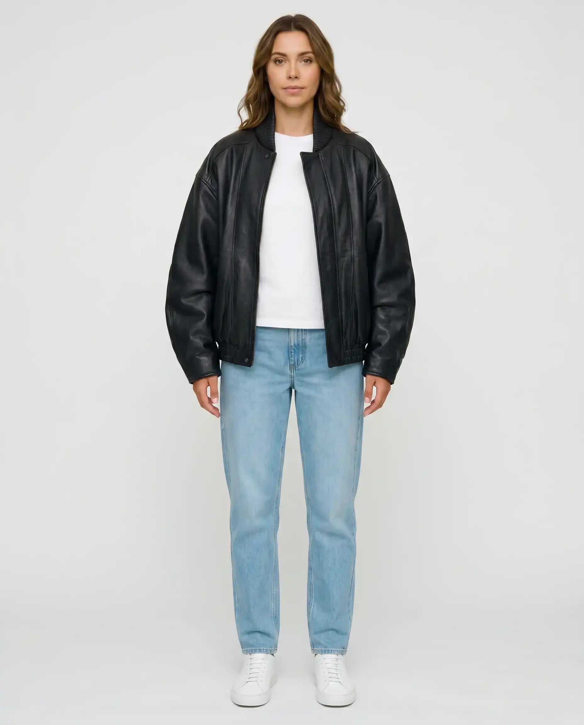 Full-length view of The Sora women's black genuine lambskin oversized bomber leather jacket by Amrika Leather styled with a casual outfit.