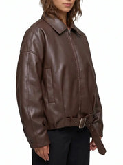 Side view of The Veya women's brown genuine lambskin oversized belted leather jacket by Amrika Leather showcasing the relaxed silhouette and modern profile.