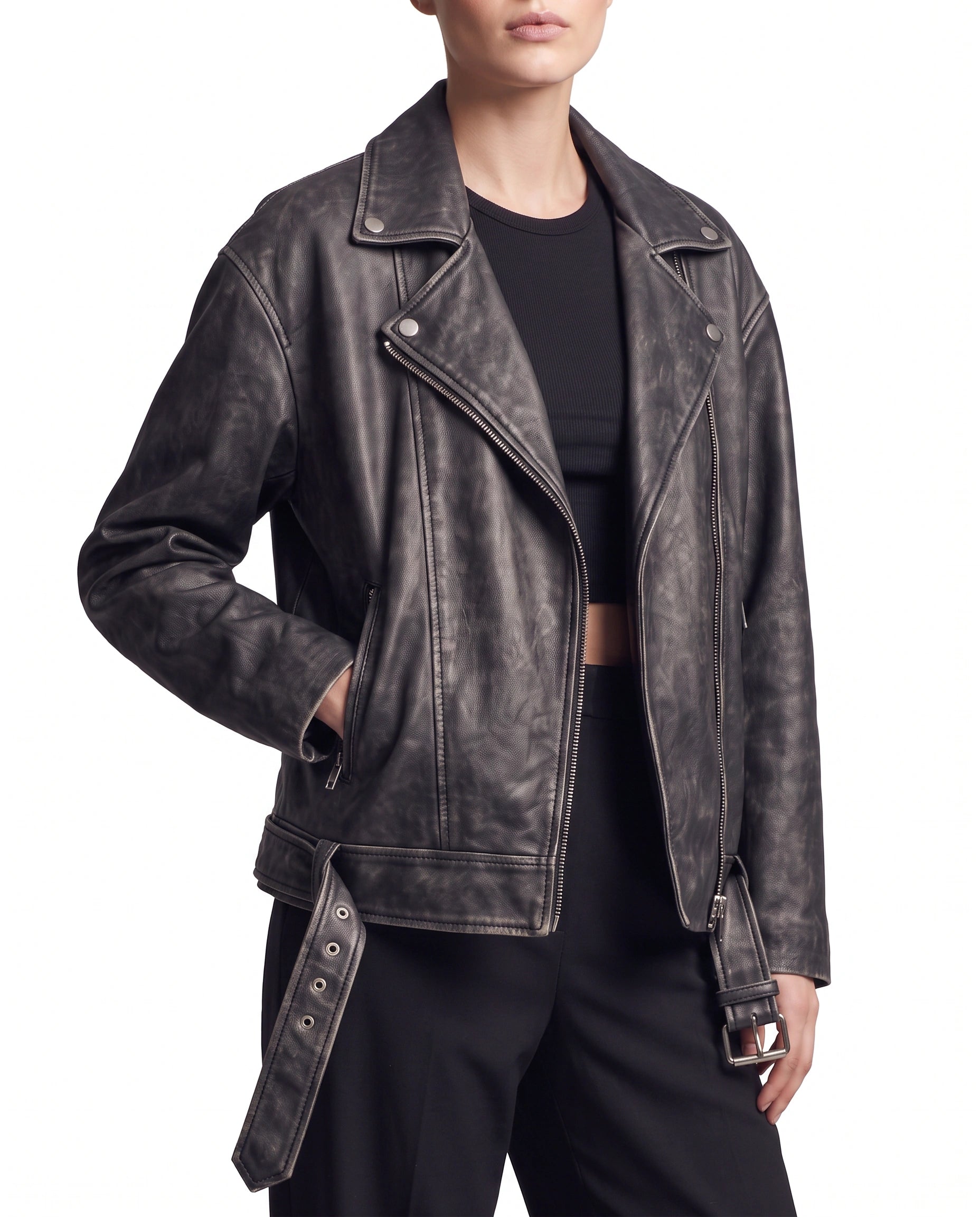 Side view of The Zora women's oversized worn-off lambskin motorcycle leather jacket showcasing its relaxed fit, long sleeves, and distressed leather finish.