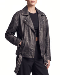 Side view of The Zora women's oversized worn-off lambskin motorcycle leather jacket showcasing its relaxed fit, long sleeves, and distressed leather finish.