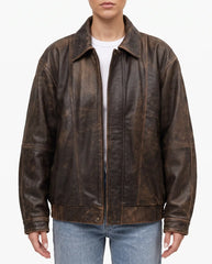 Front view of The Aspen women's oversized distressed brown lambskin leather jacket.
