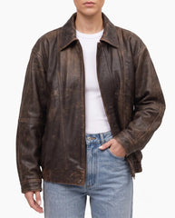 Model wearing The Aspen women's oversized distressed brown lambskin leather jacket.