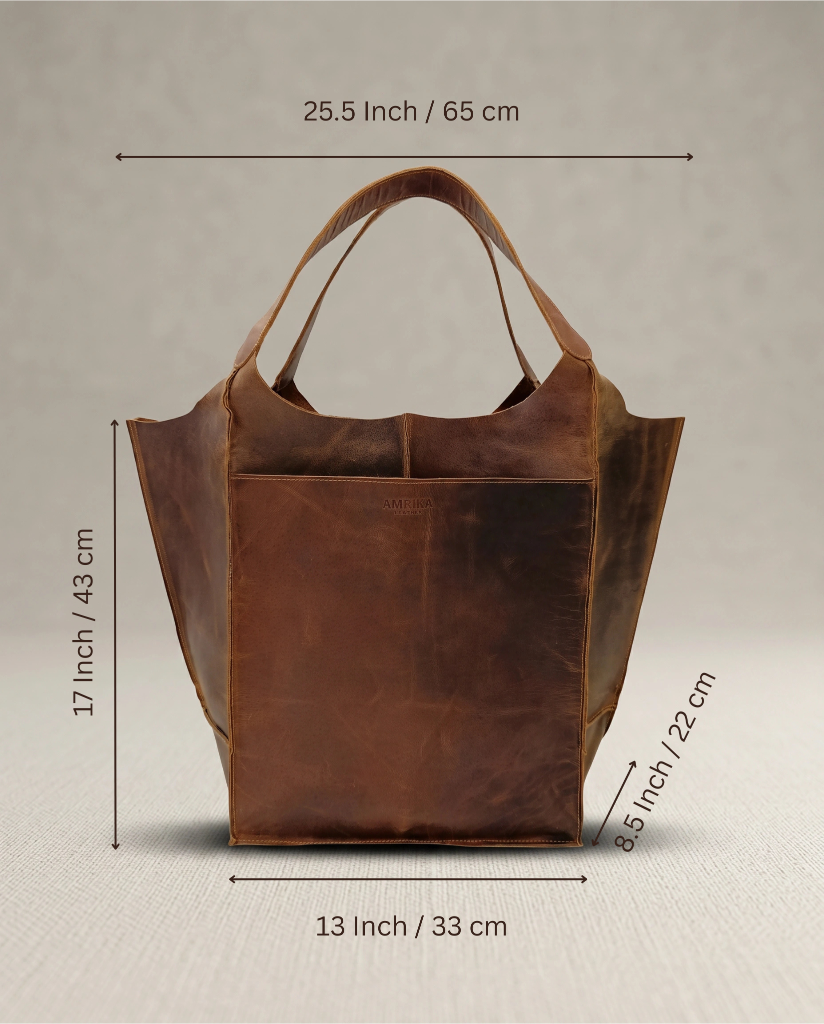 Dimensions of The Grand large buffalo leather tote bag by Amrika Leather, designed to fit a laptop and everyday essentials.